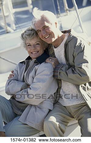 Stock Image - Portrait of a senior couple holding each other. Fotosearch