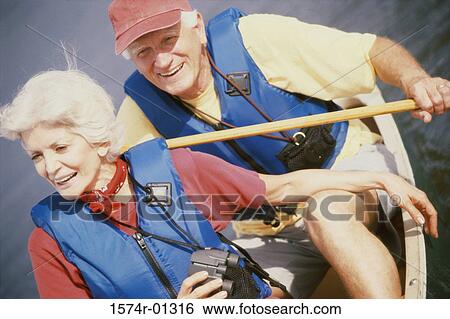 Stock Photograph - Senior couple in a row boat. Fotosearch