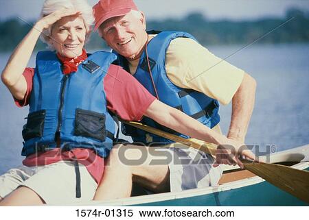 Stock Photography - Senior couple in a row boat. Fotosearch