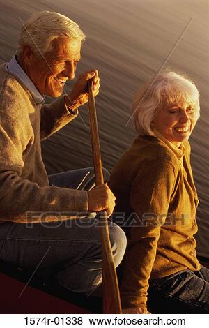 Stock Photo - Senior couple sitting in a row boat. Fotosearch