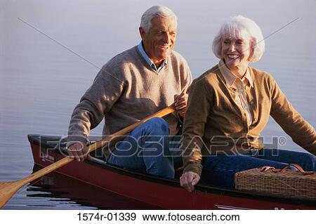 Stock Photo - Senior couple sitting in a row boat. Fotosearch