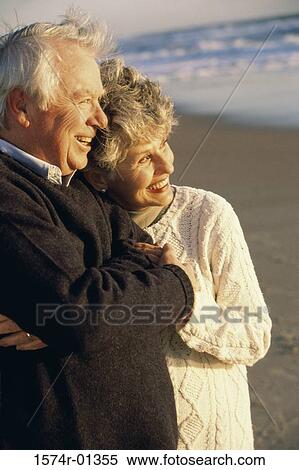 Stock Photography - Senior couple together at the beach. Fotosearch