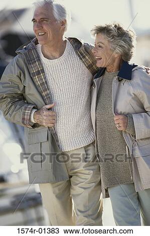 Senior couple walking together View Large Photo Image Stock Image - Senior couple walking together. Fotosearch