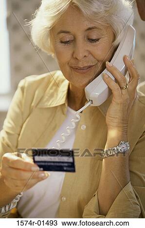 Senior woman holding a credit card View Large Photo Image Stock Image - Senior woman holding a credit card. Fotosearch