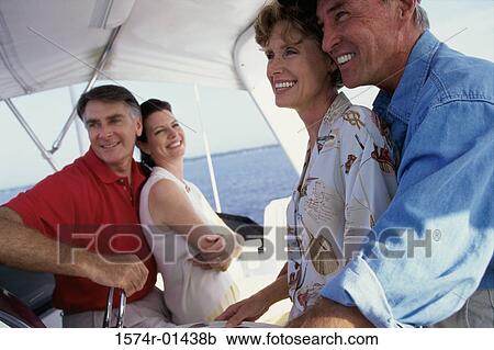 Two couples on a boat View Large Photo Image Stock Image - Two couples on a boat. Fotosearch