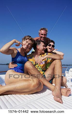 Two couples on a boat View Large Photo Image Stock Image - Two couples on a boat. Fotosearch