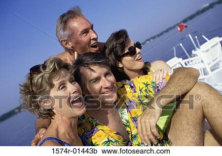 Stock Image - Two couples on a boat. Fotosearch
