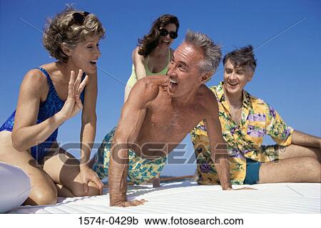 Stock Image - Two couples on a boat. Fotosearch