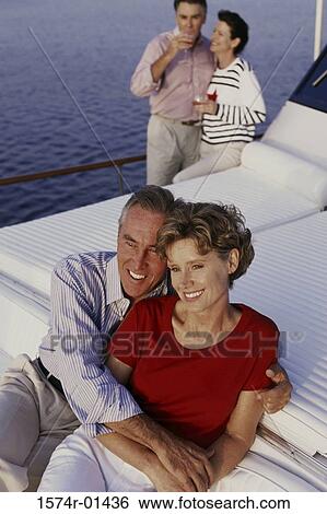 Two couples on a boat View Large Photo Image Stock Photograph - Two couples on a boat. Fotosearch