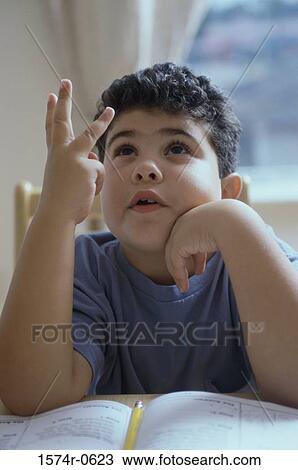 Boy counting on his fingers View Large Photo Image Stock Image - Boy counting on his fingers. Fotosearch