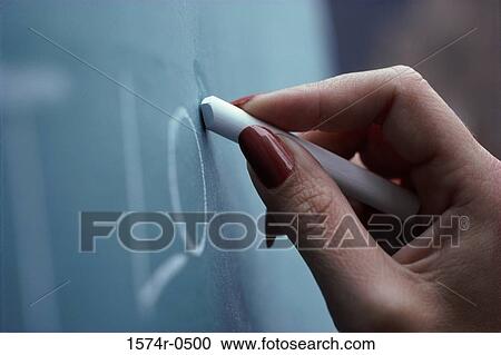 Close-up of person's hand writing on a chalkboard View Large Photo Image Stock Image - Close-up of person's hand writing on a chalkboard. Fotosearch