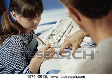 Father helping his daughter with homework View Large Photo Image Stock Image - Father helping his daughter with homework. Fotosearch