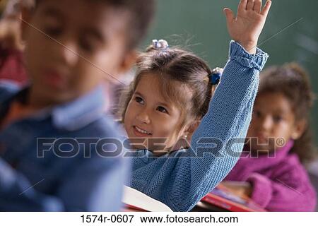 Girl raising her hand in class View Large Photo Image Stock Photo - Girl raising her hand in class. Fotosearch