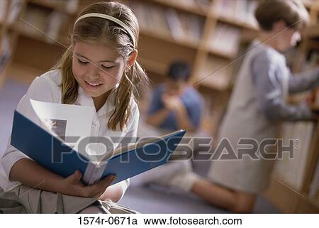 Girl reading a book View Large Photo Image Stock Image - Girl reading a book. Fotosearch