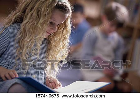 Girl reading a book View Large Photo Image Stock Photography - Girl reading a book. Fotosearch