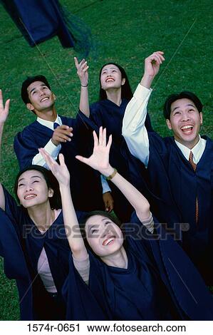 Group of students throwing their graduation hats in the air View Large Photo Image Stock Image - Group of students throwing their graduation hats in the air. Fotosearch