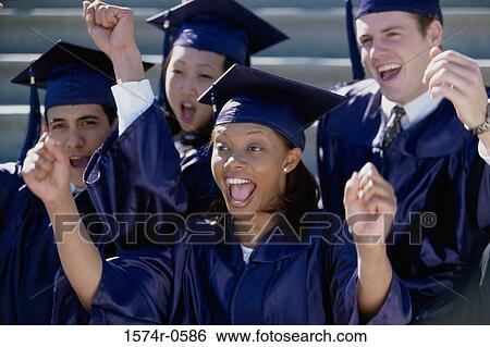 Stock Photograph - Group of students wearing graduation outfits. Fotosearch