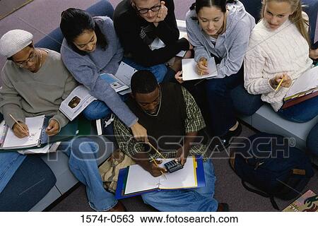 High angle view of teenagers sitting together View Large Photo Image Stock Image - High angle view of teenagers sitting together. Fotosearch