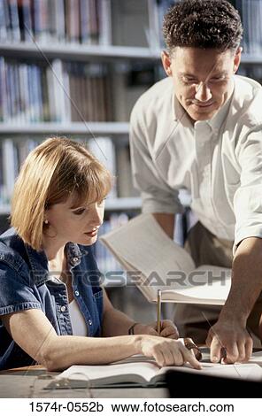 Man and woman studying together View Large Photo Image Stock Image - Man and woman studying together. Fotosearch