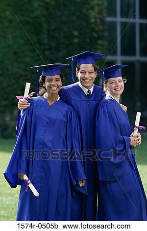 Stock Image - Portrait of a group of students wearing graduation outfits. Fotosearch