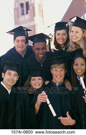 Stock Image - Portrait of a group of students wearing graduation outfits. Fotosearch