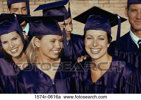 Stock Image - Portrait of a group of students wearing graduation outfits. Fotosearch