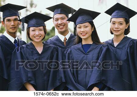 Stock Image - Portrait of a group of students wearing graduation outfits. Fotosearch