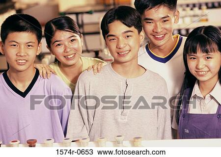 Portrait of a group of teenage students smiling View Large Photo Image Stock Image - Portrait of a group of teenage students smiling. Fotosearch