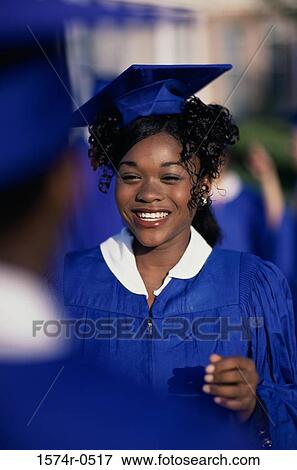 Stock Photo - Portrait of a student wearing her graduation outfit. Fotosearch