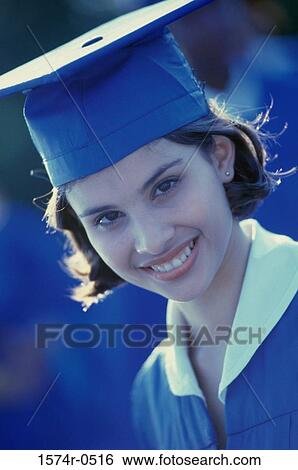 Stock Photograph - Portrait of a student wearing her graduation outfit. Fotosearch