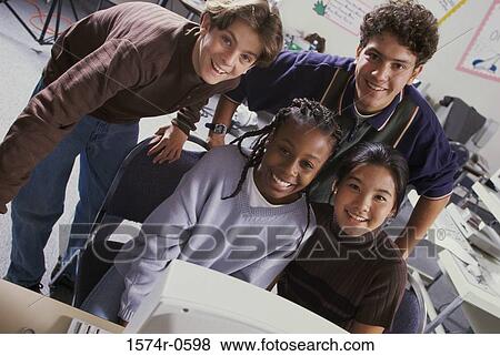 Portrait of a teenagers smiling in a classroom View Large Photo Image Stock Photo - Portrait of a teenagers smiling in a classroom. Fotosearch