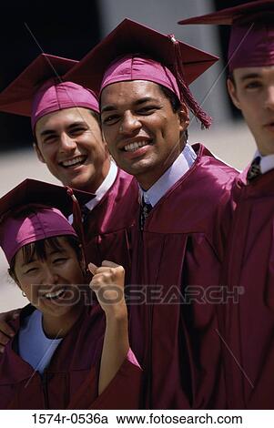 Stock Image - Portrait of students wearing their graduation outfits. Fotosearch