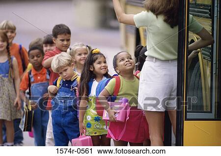 School children standing in line outside the school bus View Large Photo Image Stock Image - School children standing in line outside the school bus. Fotosearch
