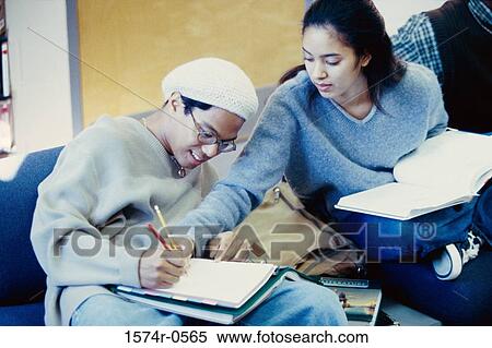 Teenage girl and a teenage boy writing in the same notebook View Large Photo Image Stock Photography - Teenage girl and a teenage boy writing in the same notebook. Fotosearch