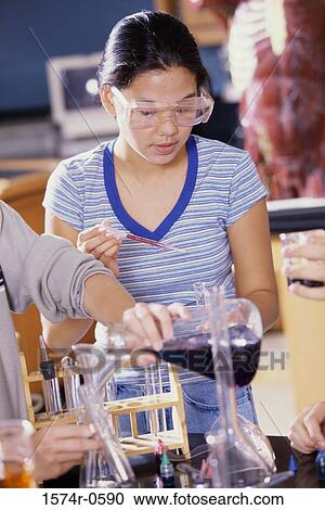 Teenage girl wearing protective eyewear in a laboratory View Large Photo Image Stock Image - Teenage girl wearing protective eyewear in a laboratory. Fotosearch