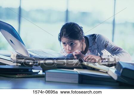 Teenage girl working on a laptop View Large Photo Image Stock Image - Teenage girl working on a laptop. Fotosearch