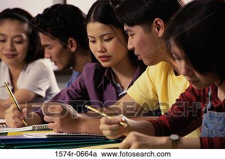 Stock Image - Teenage students in a class. Fotosearch