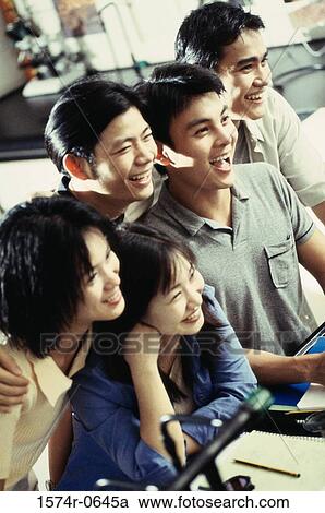 Stock Image - Teenage students laughing. Fotosearch