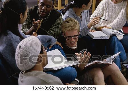 Teenagers discussing in a class View Large Photo Image Stock Image - Teenagers discussing in a class. Fotosearch