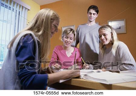 Teenagers studying together View Large Photo Image Stock Image - Teenagers studying together. Fotosearch