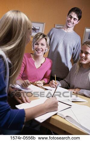 Stock Image - Teenagers studying together. Fotosearch