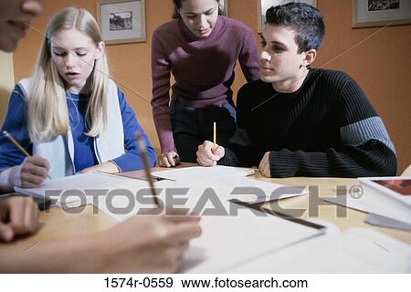 Stock Photo - Teenagers studying together. Fotosearch