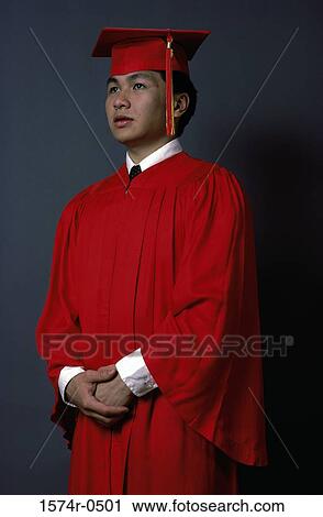 Young man wearing a graduation outfit View Large Photo Image Stock Image - Young man wearing a graduation outfit. Fotosearch