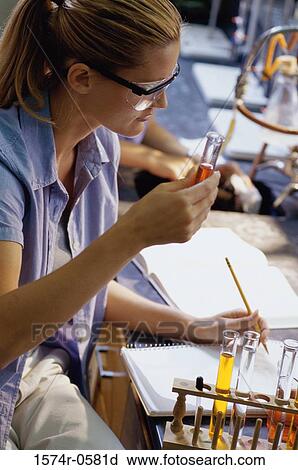 Young woman at a chemistry laboratory View Large Photo Image Stock Image - Young woman at a chemistry laboratory. Fotosearch