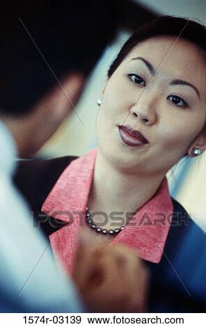 Businesswoman talking to a businessman View Large Photo Image Stock Photo - Businesswoman talking to a businessman. Fotosearch