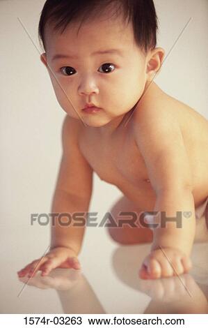 Close-up of a baby boy sitting View Large Photo Image Stock Image - Close-up of a baby boy sitting. Fotosearch