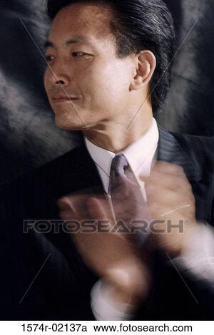 Stock Image - Close-up of a businessman clapping. Fotosearch