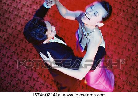 High angle view of a young couple dancing in a nightclub View Large Photo Image Stock Image - High angle view of a young couple dancing in a nightclub. Fotosearch