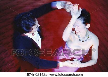 High angle view of a young couple dancing in a nightclub View Large Photo Image Stock Image - High angle view of a young couple dancing in a nightclub. Fotosearch