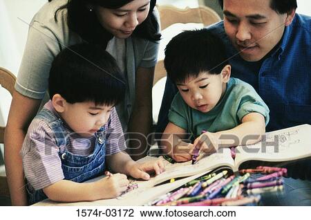 Parents watching their two sons coloring with crayons View Large Photo Image Stock Image - Parents watching their two sons coloring with crayons. Fotosearch